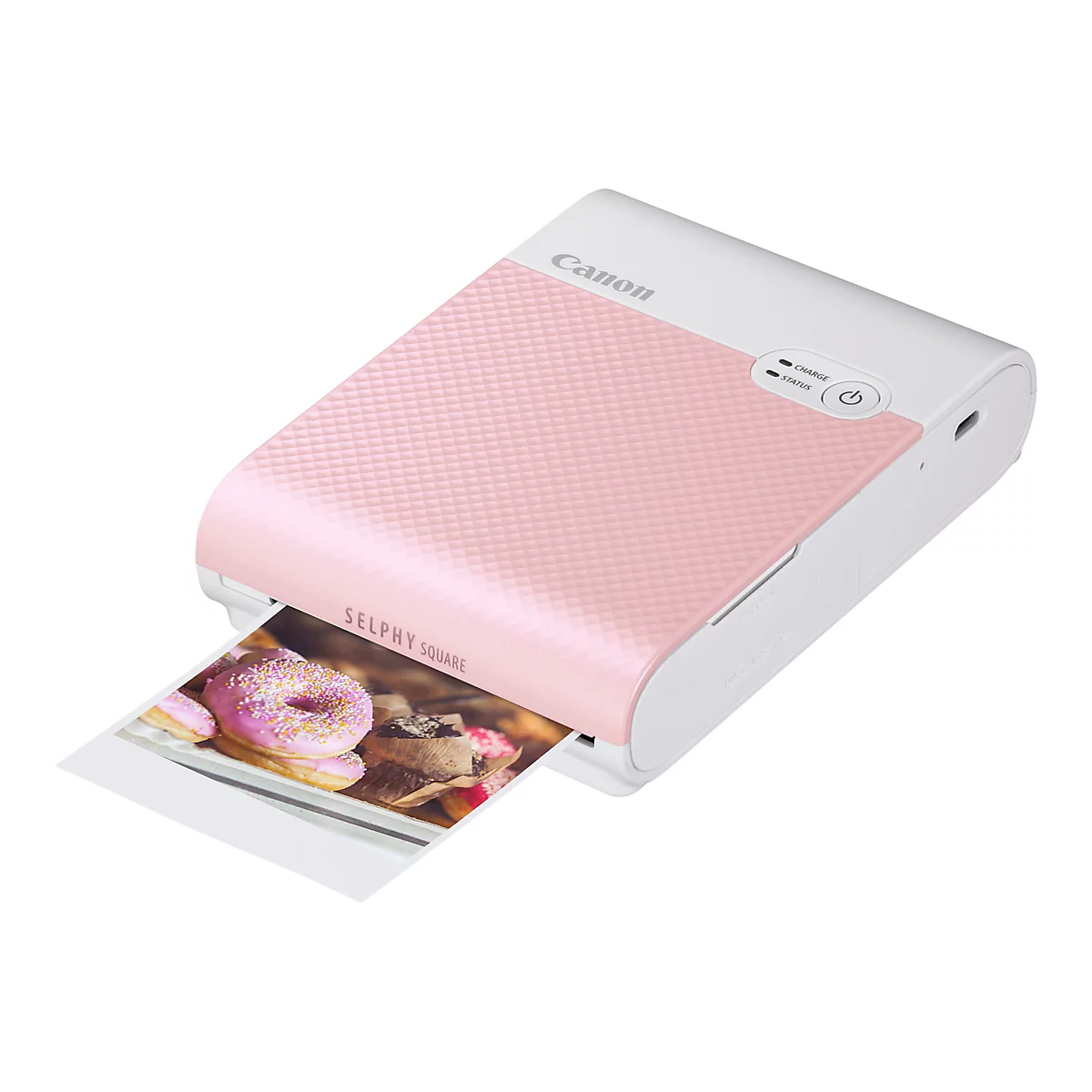 Ein rosa Canon Selphy Square Fotodrucker druckt ein Foto von Donuts.