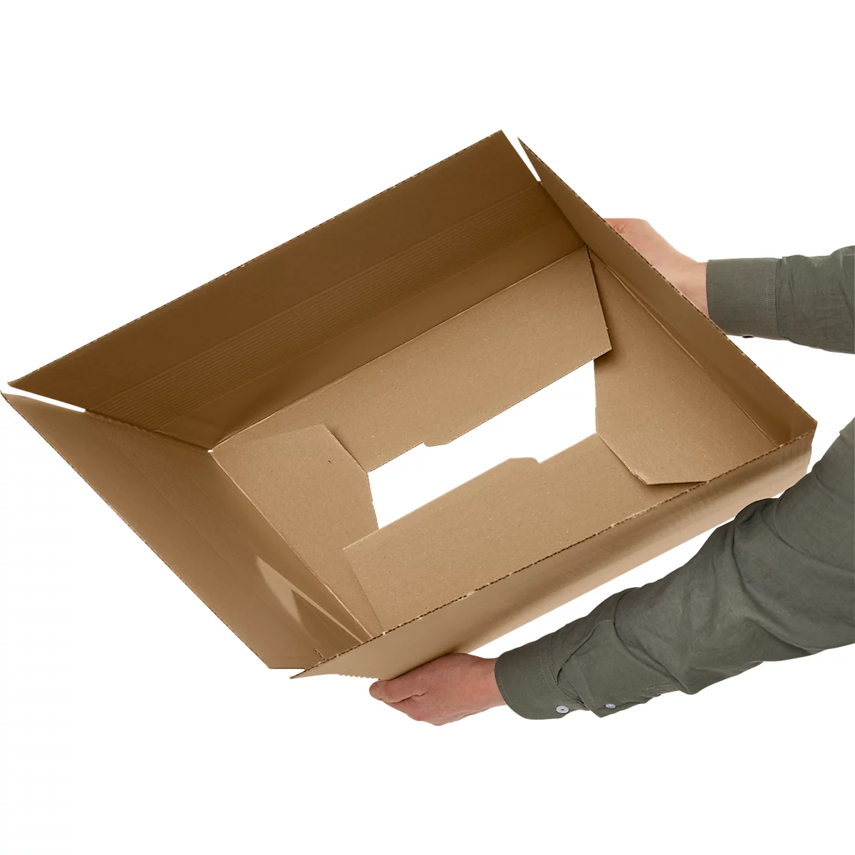 Person holding an open, brown shipping box. The box is viewed slightly from above, showing the inside.