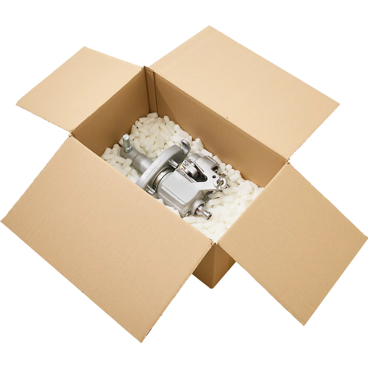 Une pièce métallique argentée se trouve dans une boîte en carton ouverte, entourée de flocons de mousse blancs.