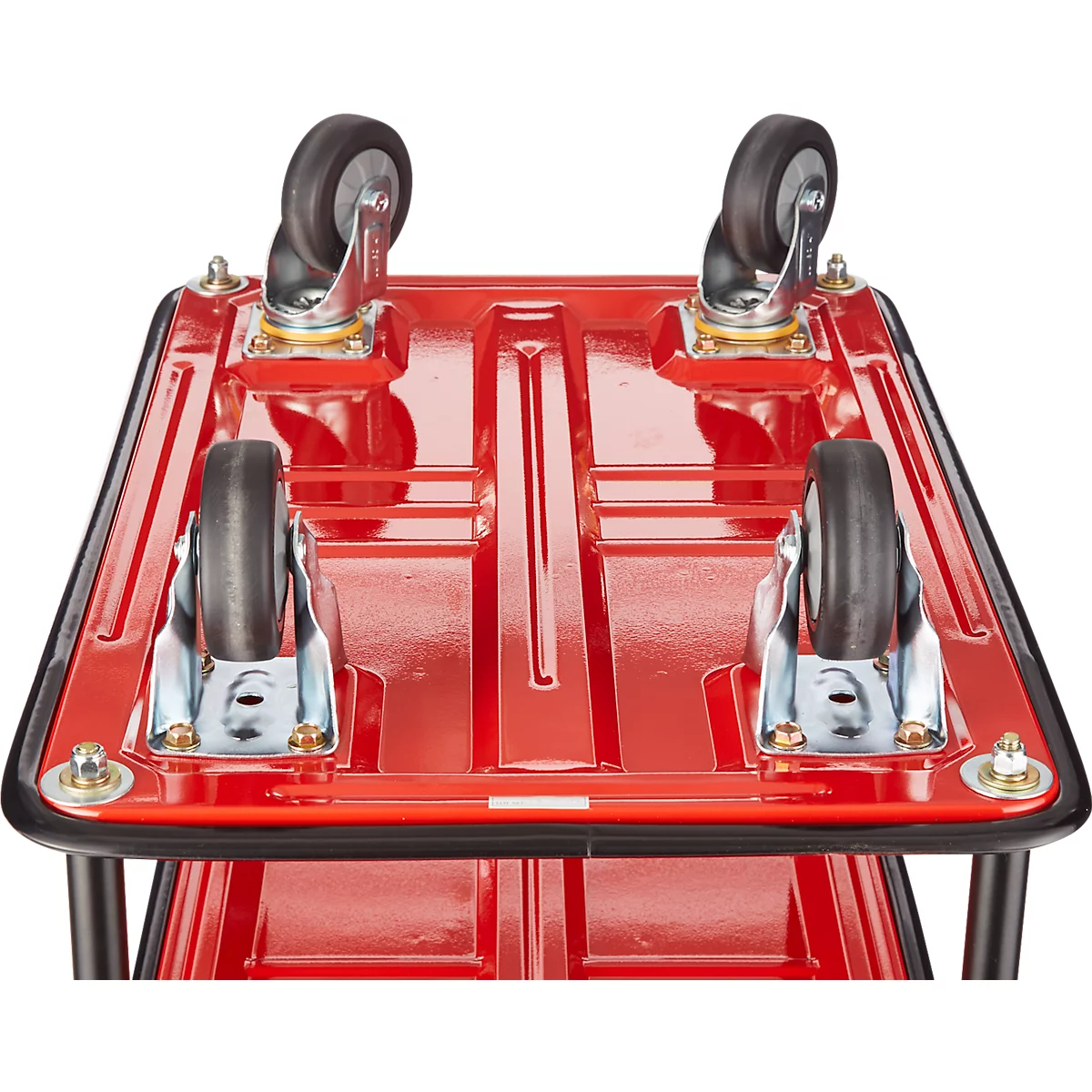 Vue de dessus d'un chariot de transport rouge avec quatre roues noires.