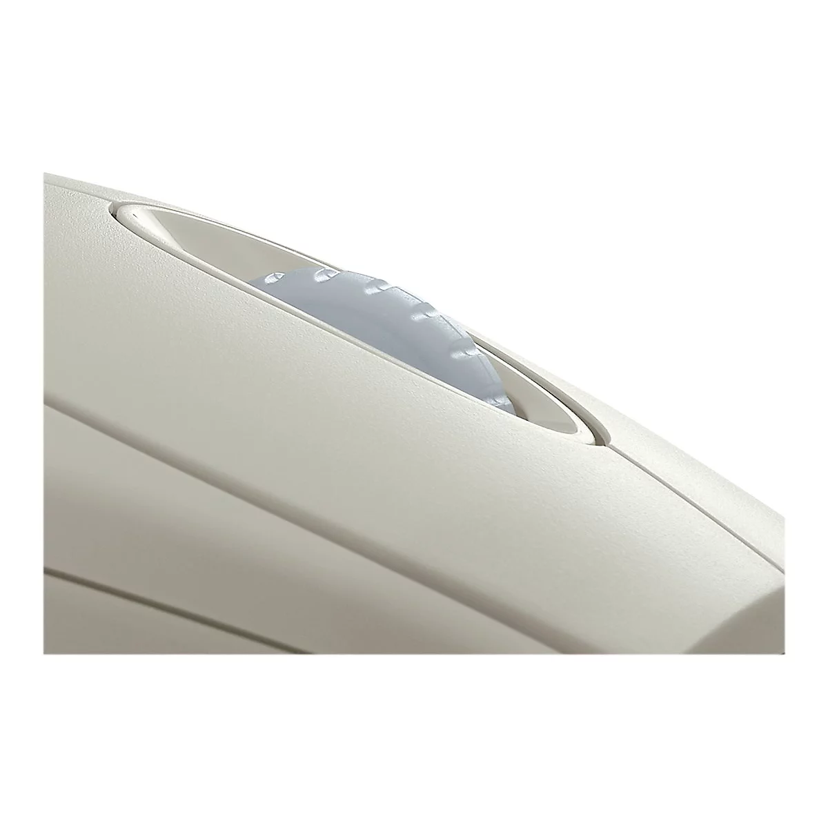 Gros plan d'un appareil beige avec un interrupteur bleu.