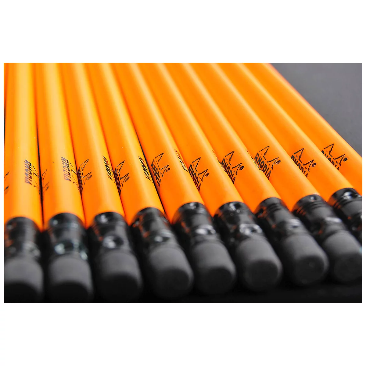 Row of yellow-orange pencils with erasers. Printed: RHODIA.
