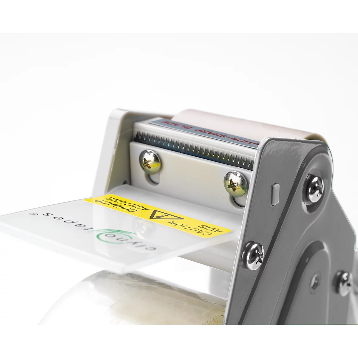 Close-up of a tape dispenser. A yellow sticker with "CAUTION" is on the plate. The device is gray and white.