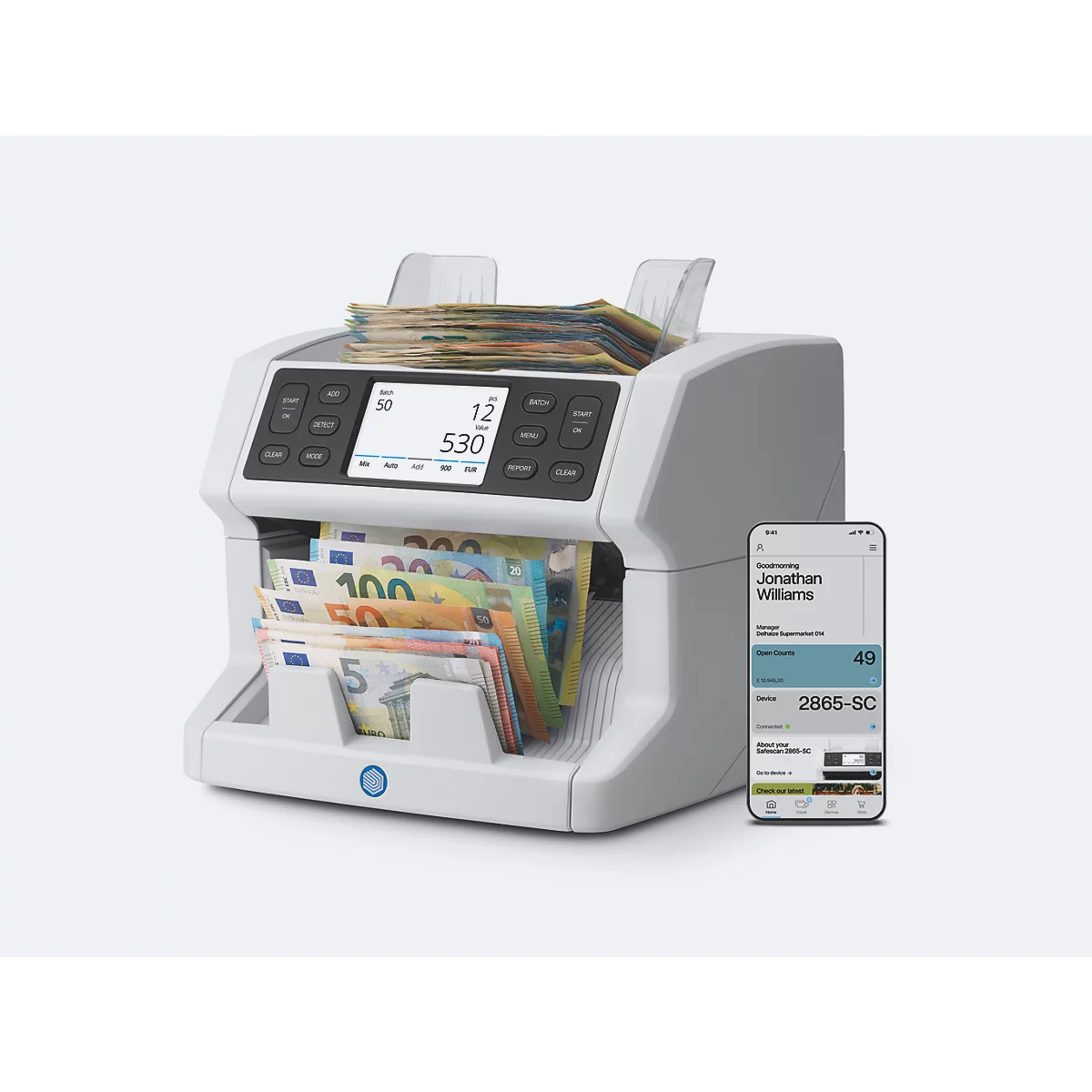 Une machine de tri d'argent blanche avec des billets de banque et un smartphone avec une application.