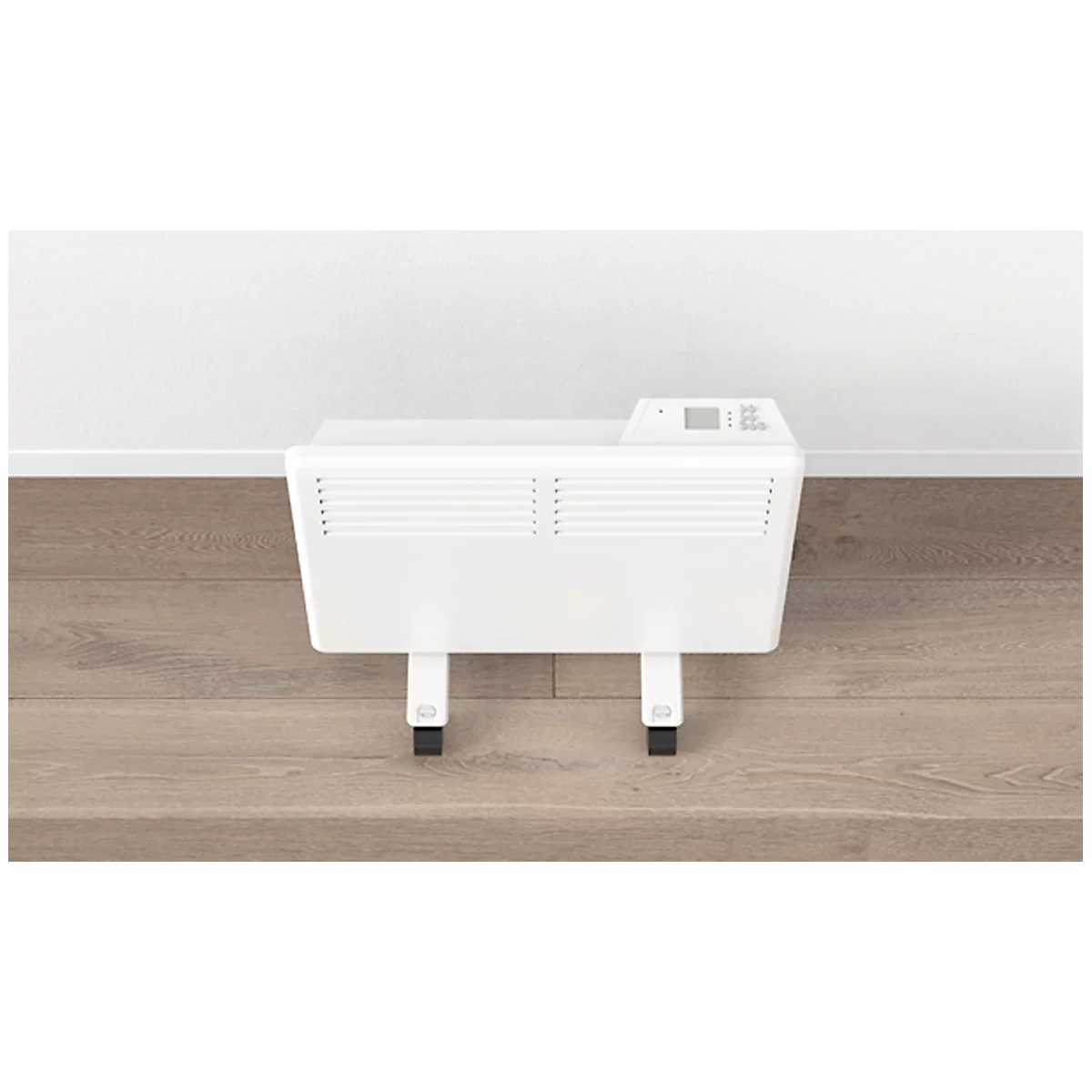 Radiateur blanc à roulettes devant un mur blanc. Sur parquet brun. Petit écran.