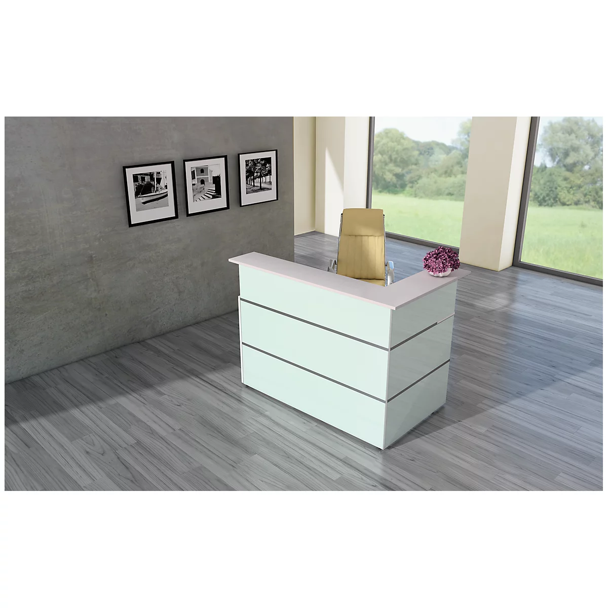 Bright reception desk against a gray wall, three black and white pictures, chair and flowers. Large windows overlooking nature.