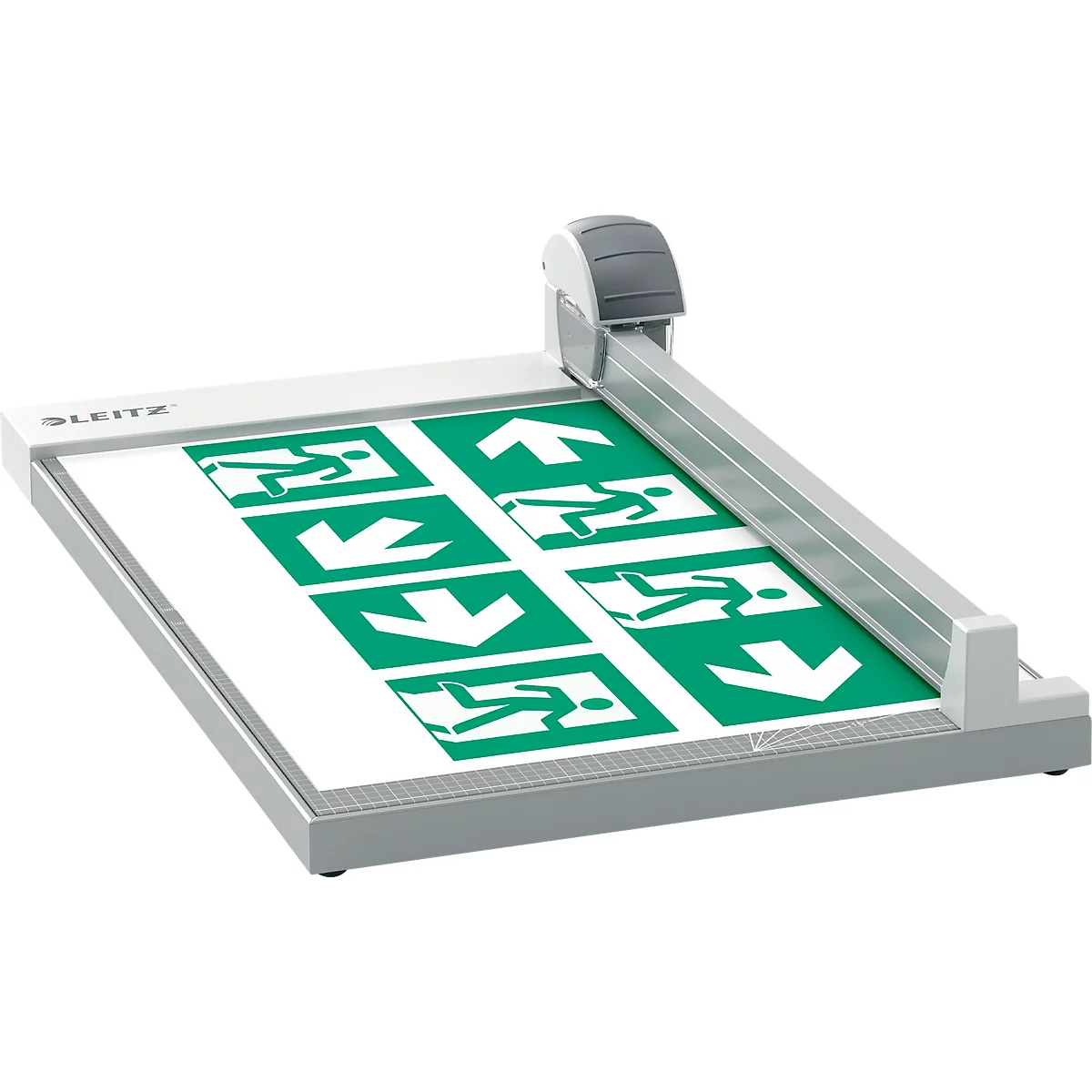 Une massicot grise coupant une feuille avec des panneaux de sortie verts.