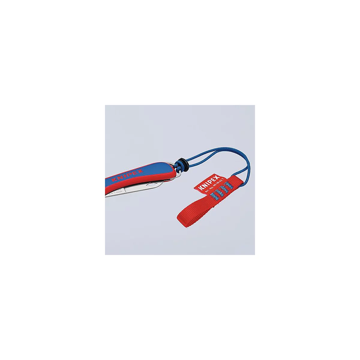 Couteau de poche avec manche rouge et bleu et boucle rouge avec inscription KNIPEX. Corde bleue reliant le couteau et la boucle.