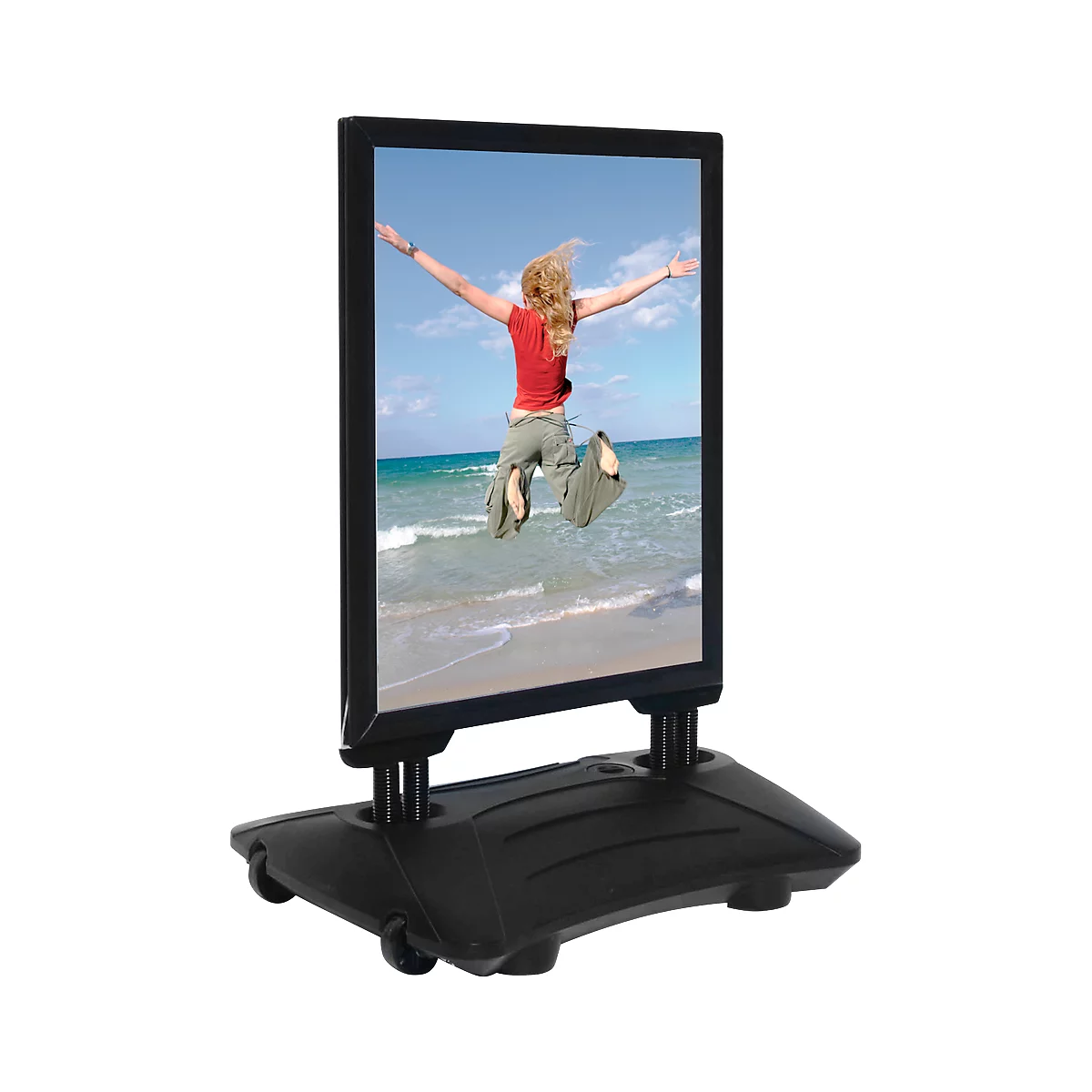 Advertising sign with a picture of a woman jumping on the beach. Black frame, black base with wheels.