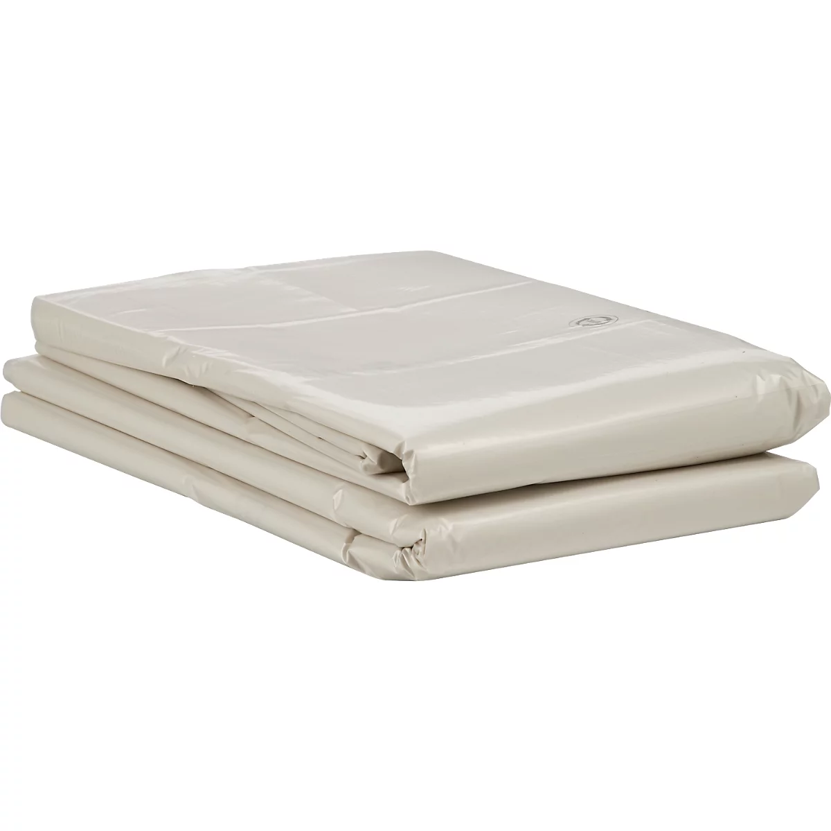 Gevouwen beige laken dat op een oppervlak ligt.