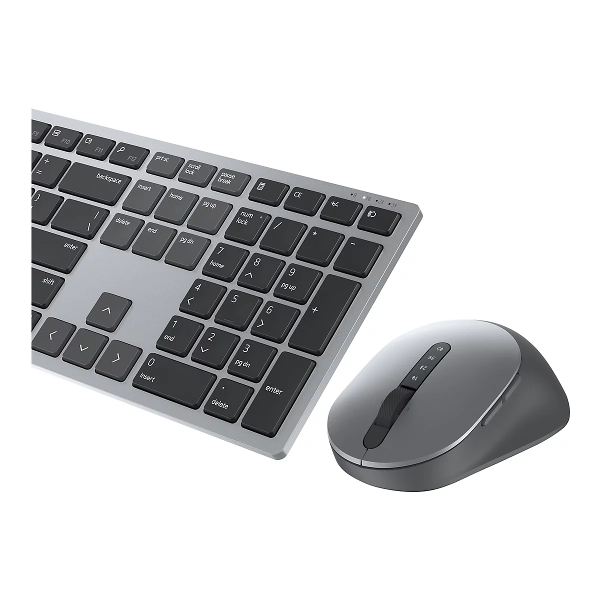 Un ensemble clavier et souris sans fil gris, photographié en studio. Le clavier a des touches grises et un boîtier argenté. La souris est également grise.