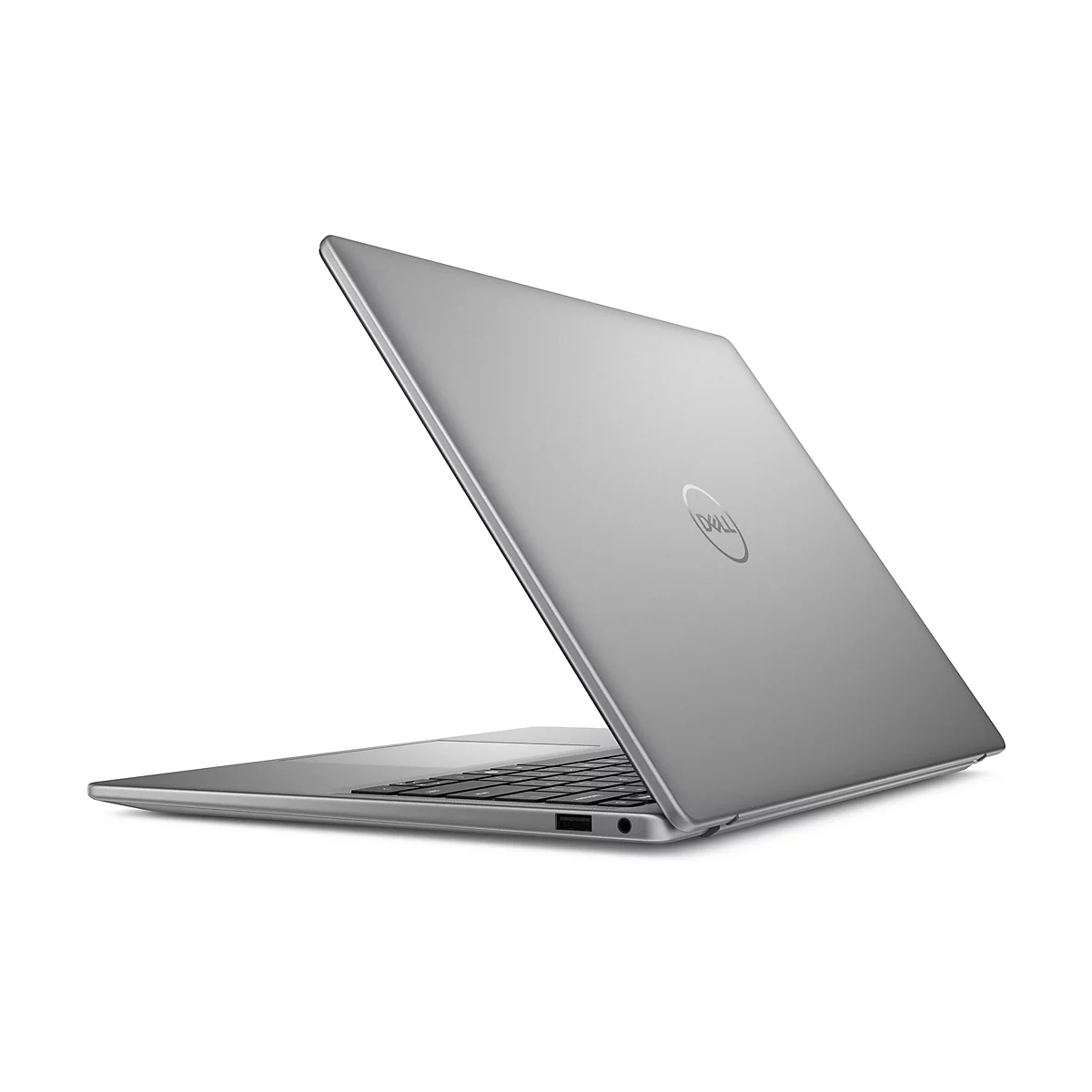 Ein silberner Laptop, teilweise geöffnet, wird schräg von hinten gezeigt. Der Deckel trägt das Dell-Logo.