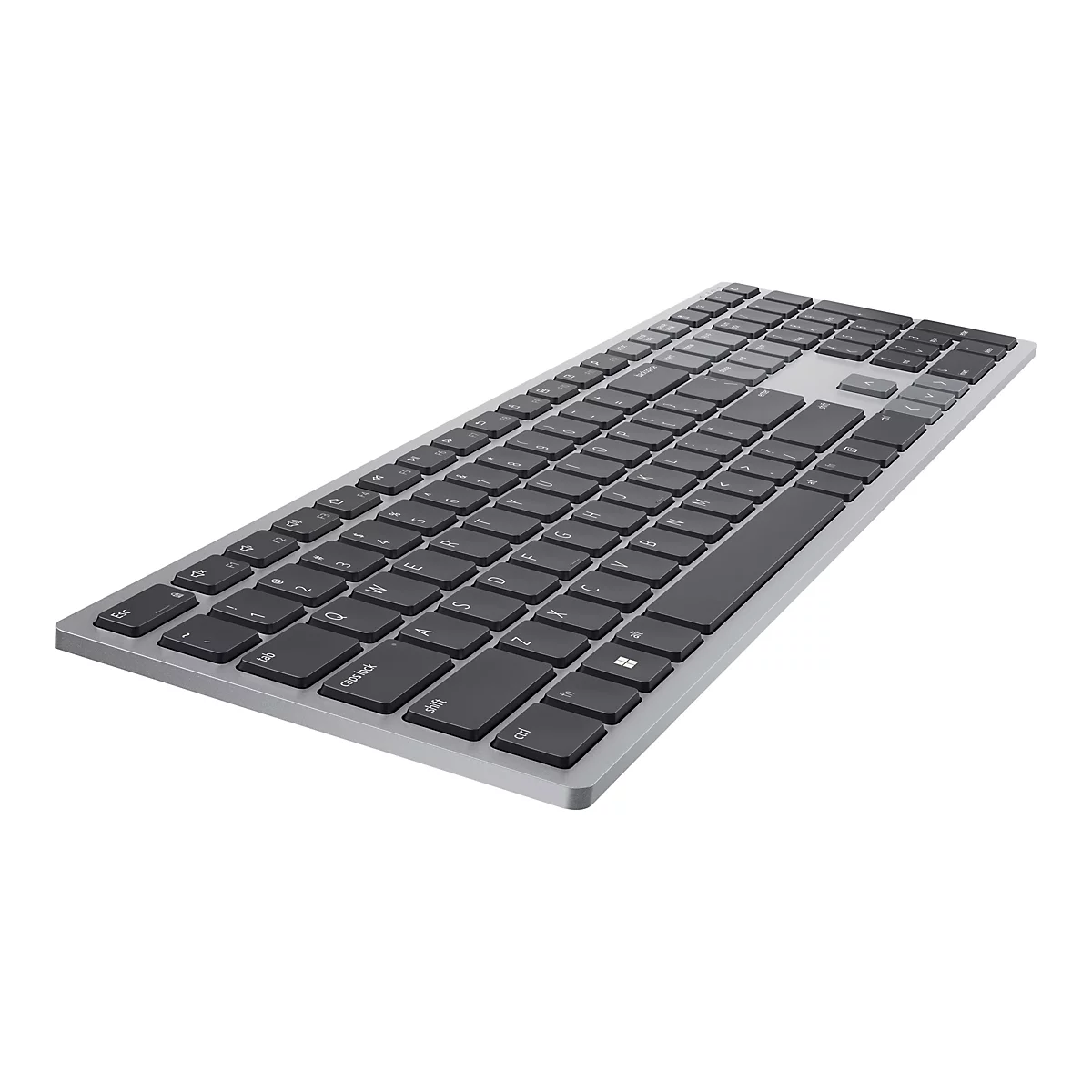 Clavier gris avec touches noires, en léger angle sur fond blanc.