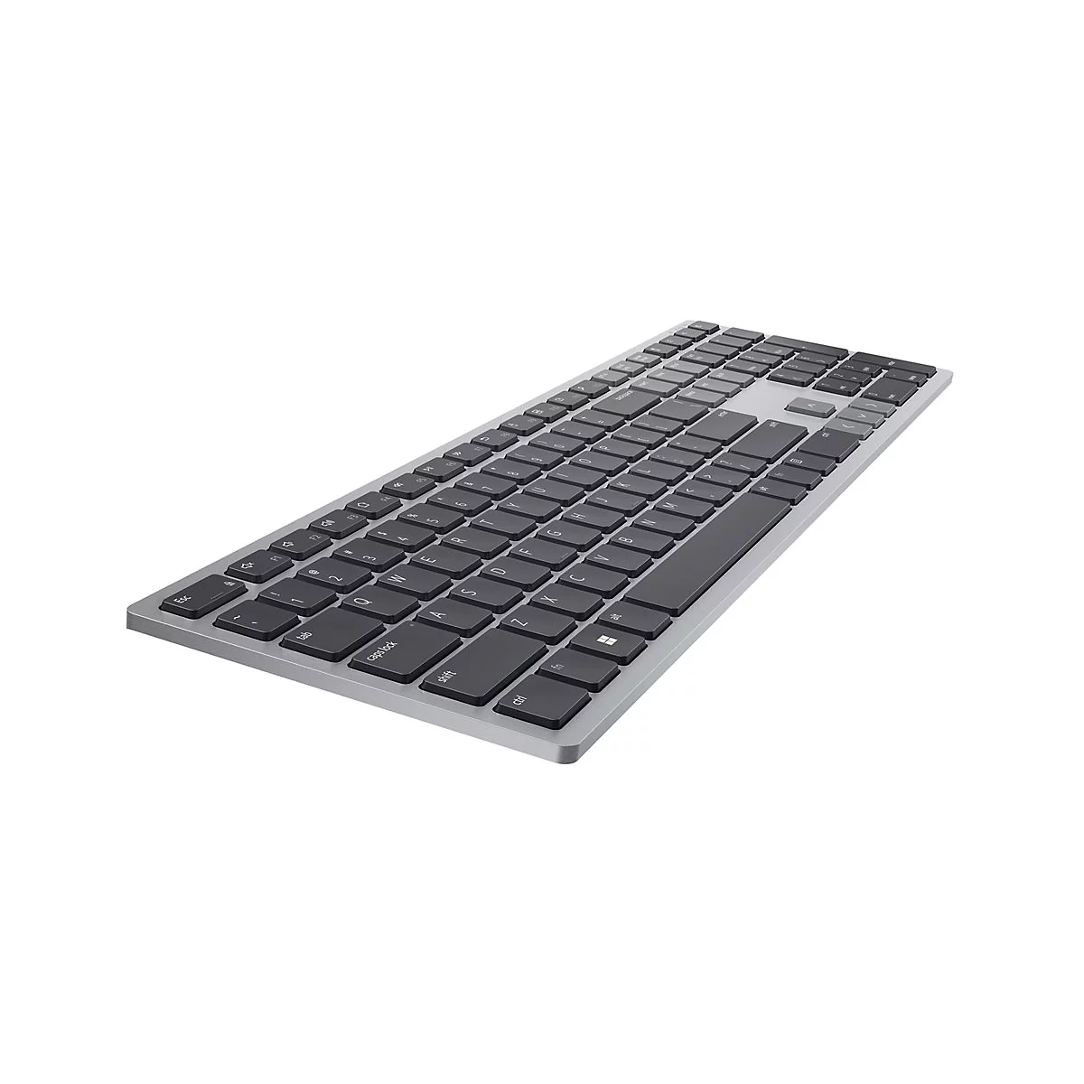 Draufsicht auf eine silberne Tastatur mit schwarzen Tasten. Die Tasten sind flach und rechteckig angeordnet.