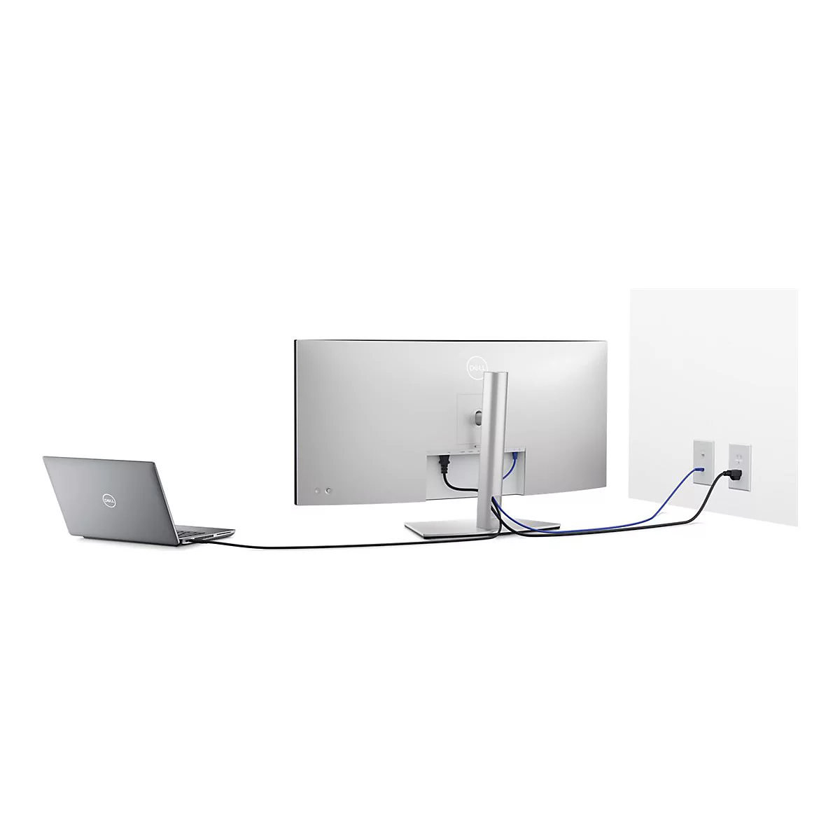 Rückansicht eines Dell Monitors und Laptops, verbunden mit Kabeln an einer weißen Wand.
