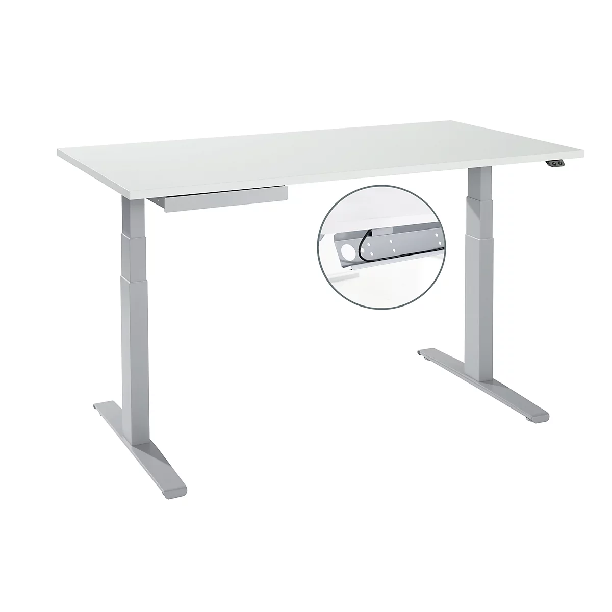 Height-adjustable desk with white tabletop and silver legs. Detail: Cable management.
