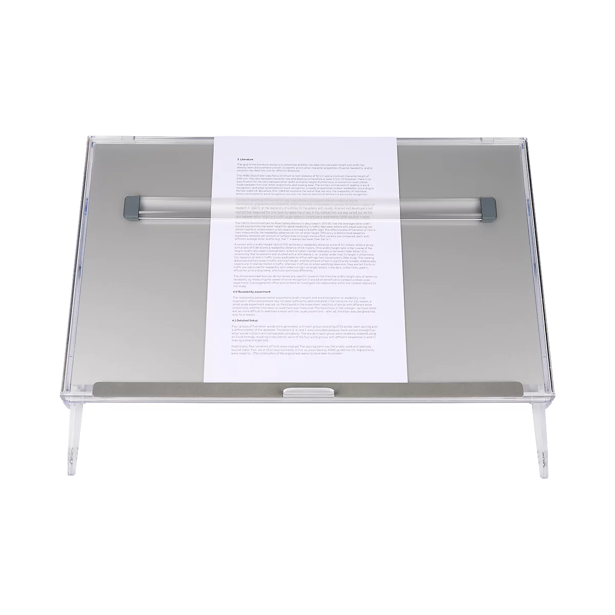 Transparent angled reading stand with paper. Text is on the paper.