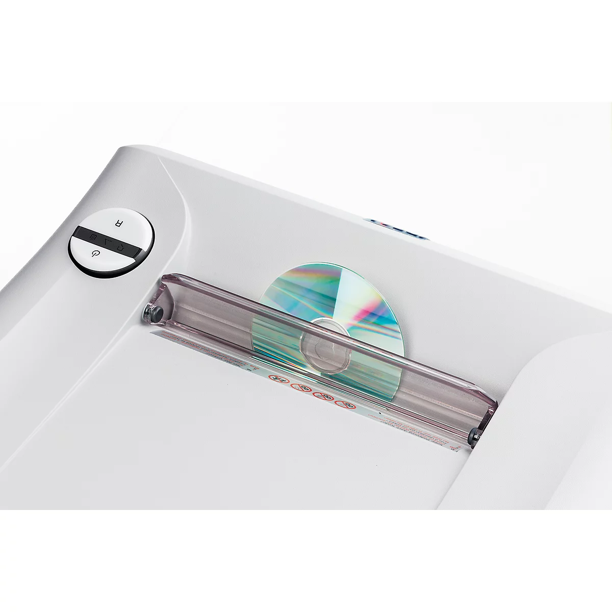 Close-up of a white device with a CD inserted.