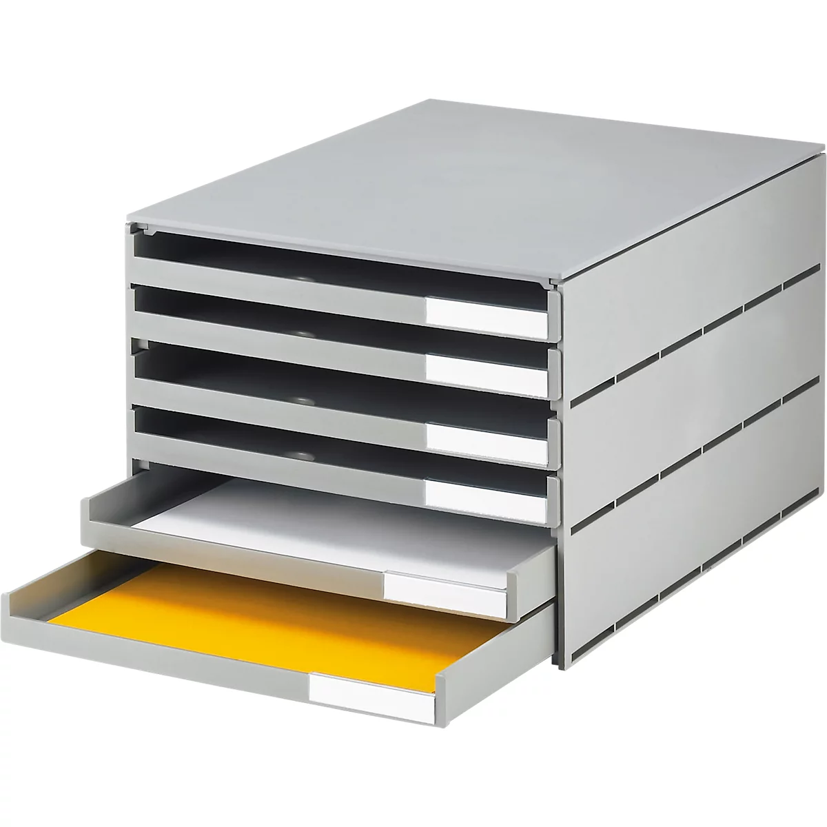 Gray drawer system with six compartments, two drawers open. White paper visible top left, yellow bottom.