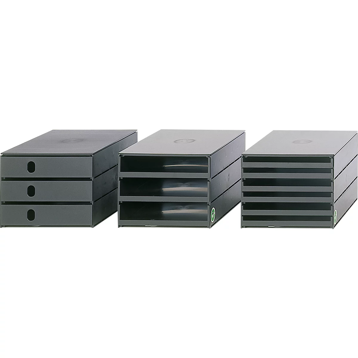 Three grey office desk trays in different designs. One with drawers, the others with open compartments.
