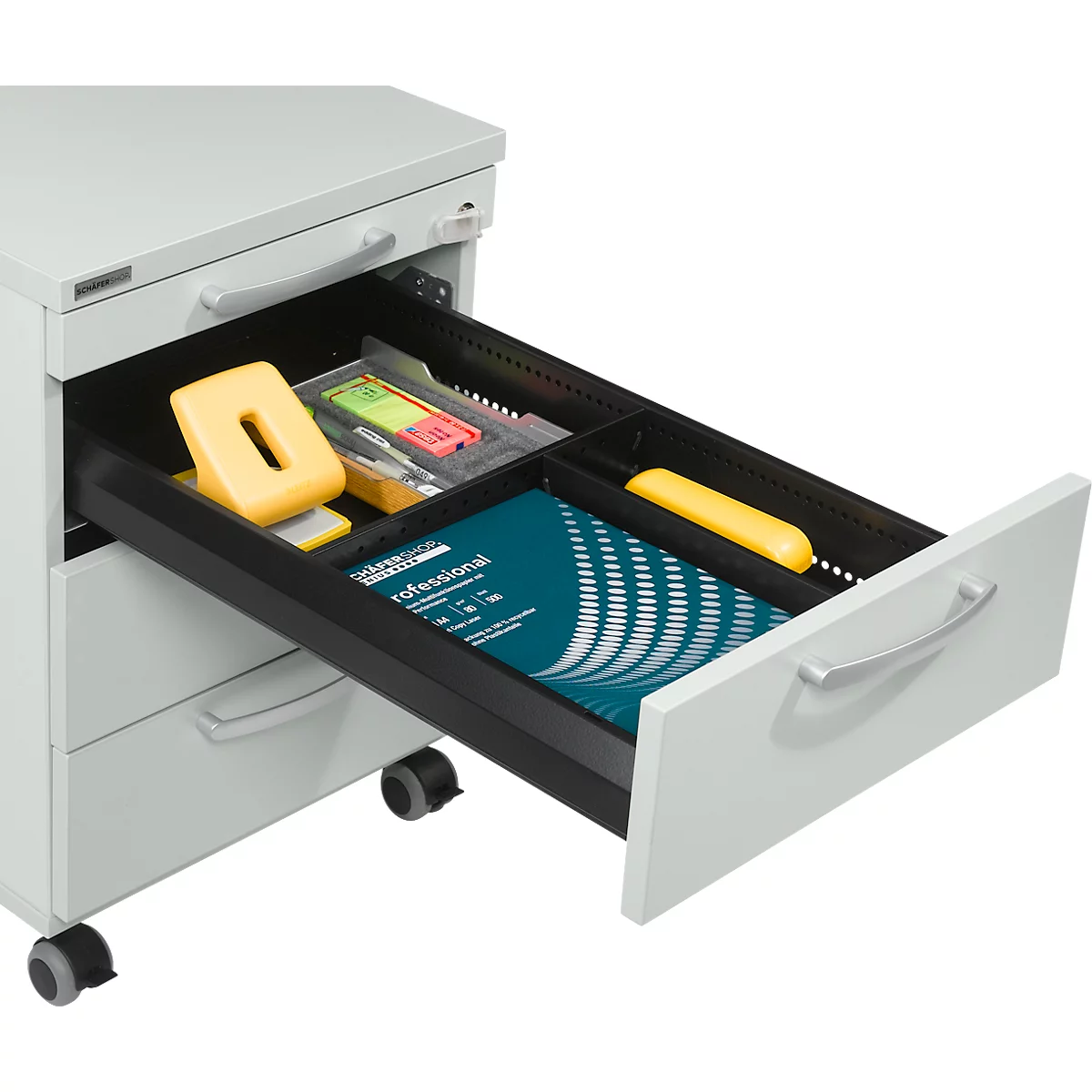 Grey office cabinet with open drawer. It contains yellow hole punch, pens and a brochure.