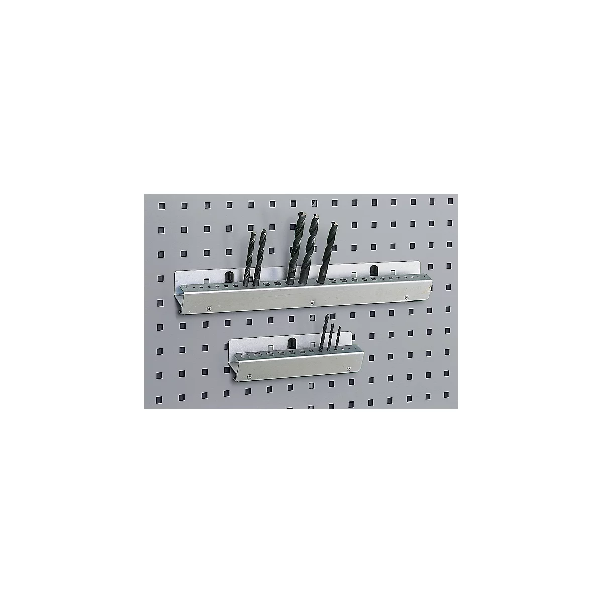 Metal drill bit holders with drill bits, attached to a gray pegboard.