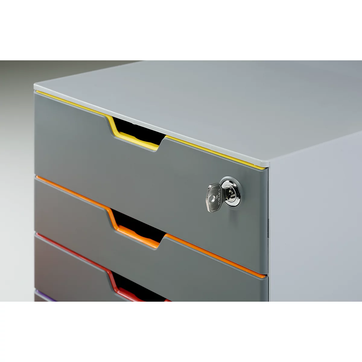 Grey filing cabinet with colorful accents, a key is in the lock.