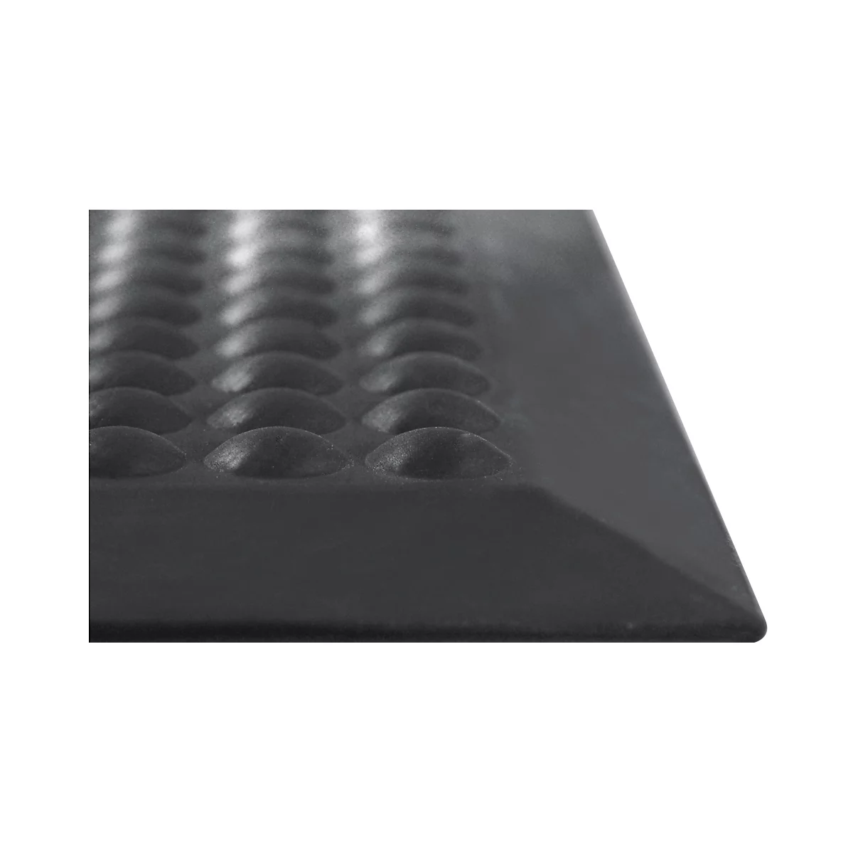 Close-up of a black, ridged mat with rounded knobs.