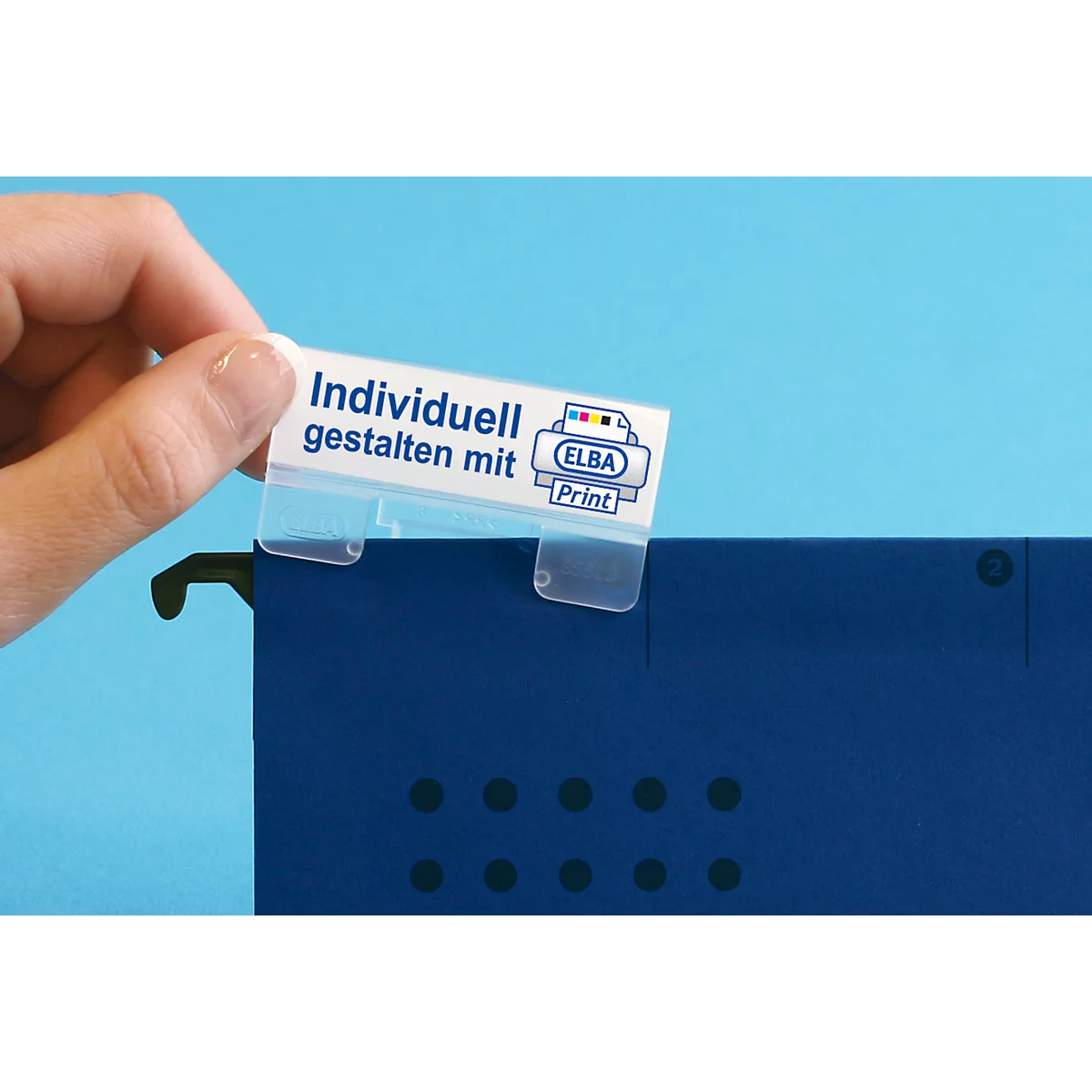 A hand holds a white label that reads "Individually designed with" and the ELBA Print logo over a blue folder.