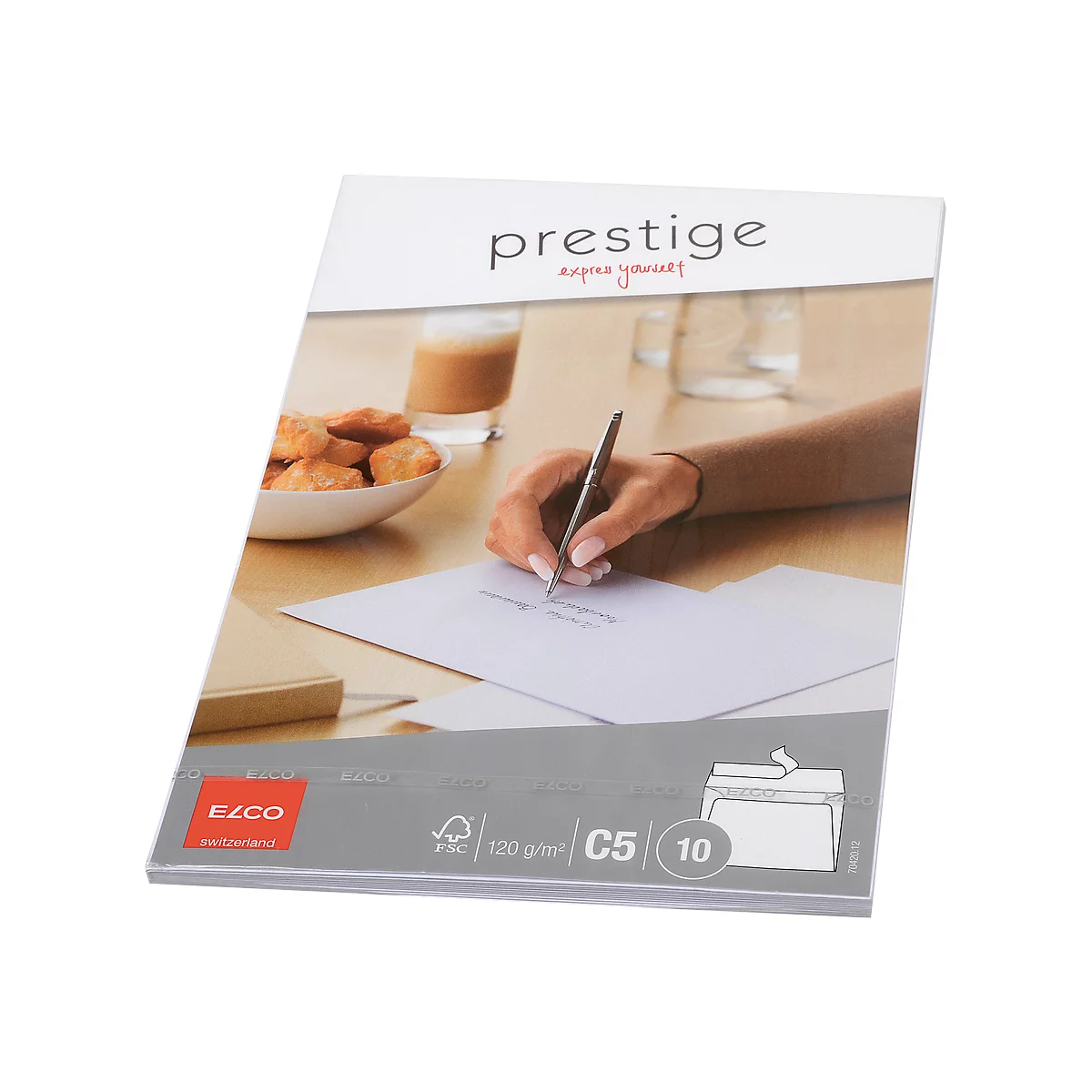 Person writing on paper with a pen. Baked goods, drinks and paper are on the table. "prestige" is at the top.