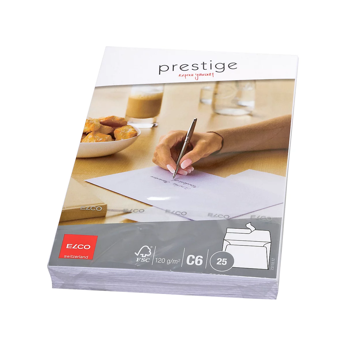 A person writing with a pen on paper. Pastries, a drink, and envelopes are on a table.