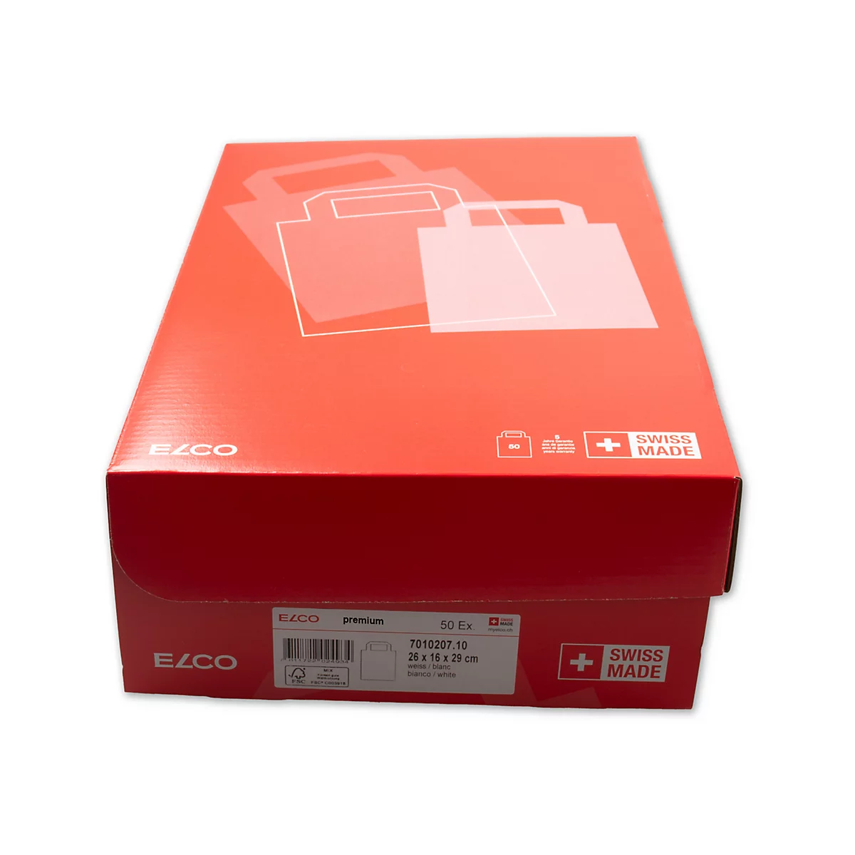 Boîte rouge avec des contours de sacs à provisions sur le dessus. Le côté indique "Swiss Made".