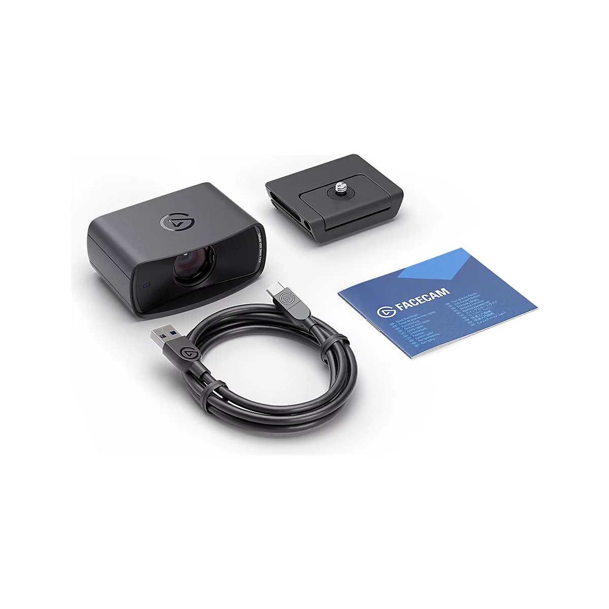 Schwarze Facecam mit Zubehör. Auf weißem Hintergrund liegen Kamera, Halterung, Kabel und Anleitung.