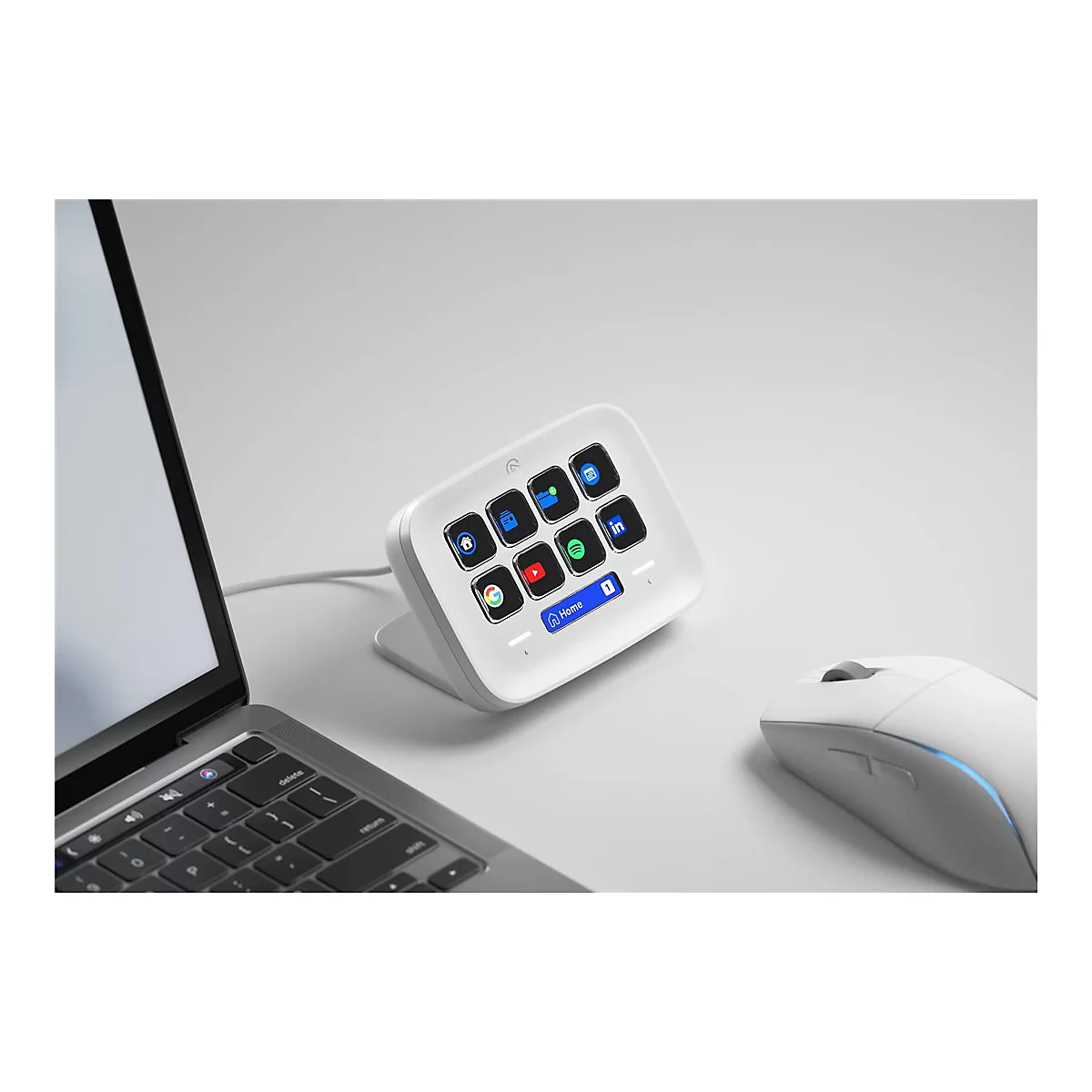 Weißes Bedienfeld mit App-Symbolen und einem Laptop, Maus. Auf dem Bildschirm steht Home.