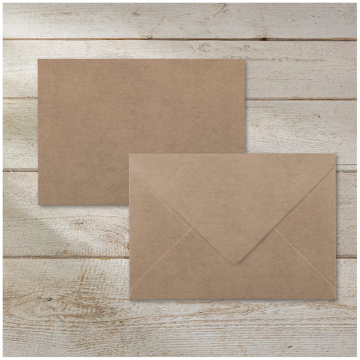 Two brown envelopes against a light wood background. The lower envelope is open.