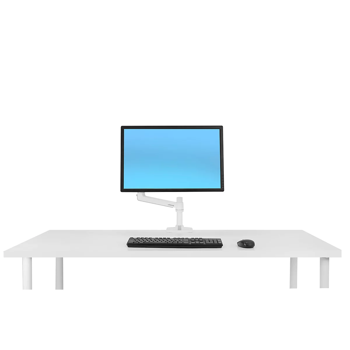 Desk with monitor on bracket, keyboard and mouse.