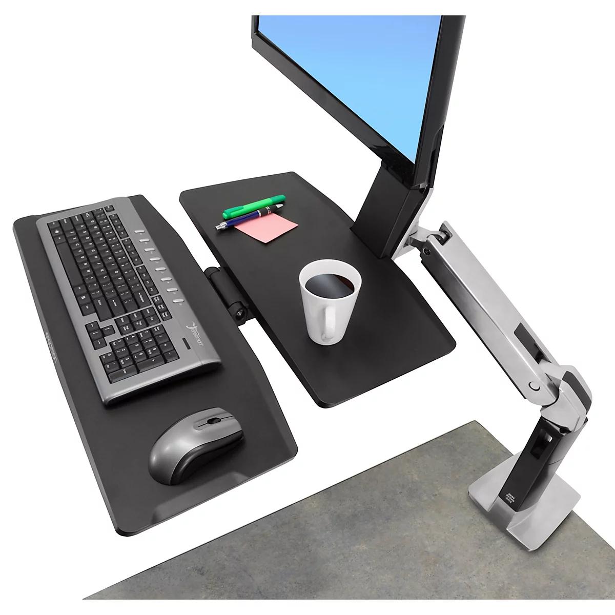Ergonomic desk with monitor, keyboard, mouse and cup of coffee.