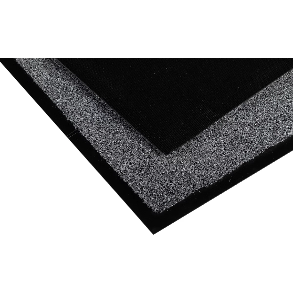 Primer plano de una esquina de una alfombra negra con un borde gris.