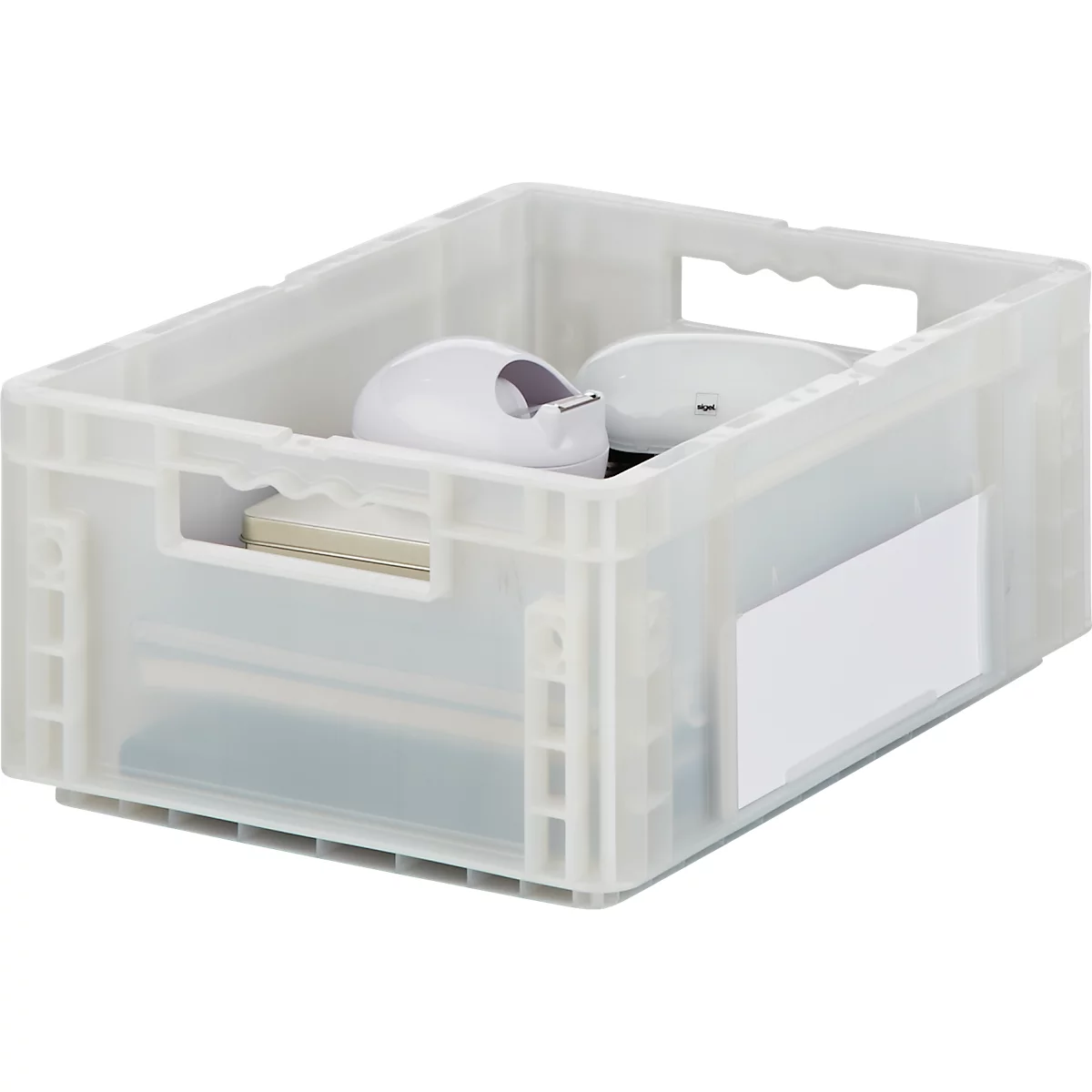 Boîte en plastique transparente avec fournitures de bureau : dévidoir adhésif, bloc-notes, CD.