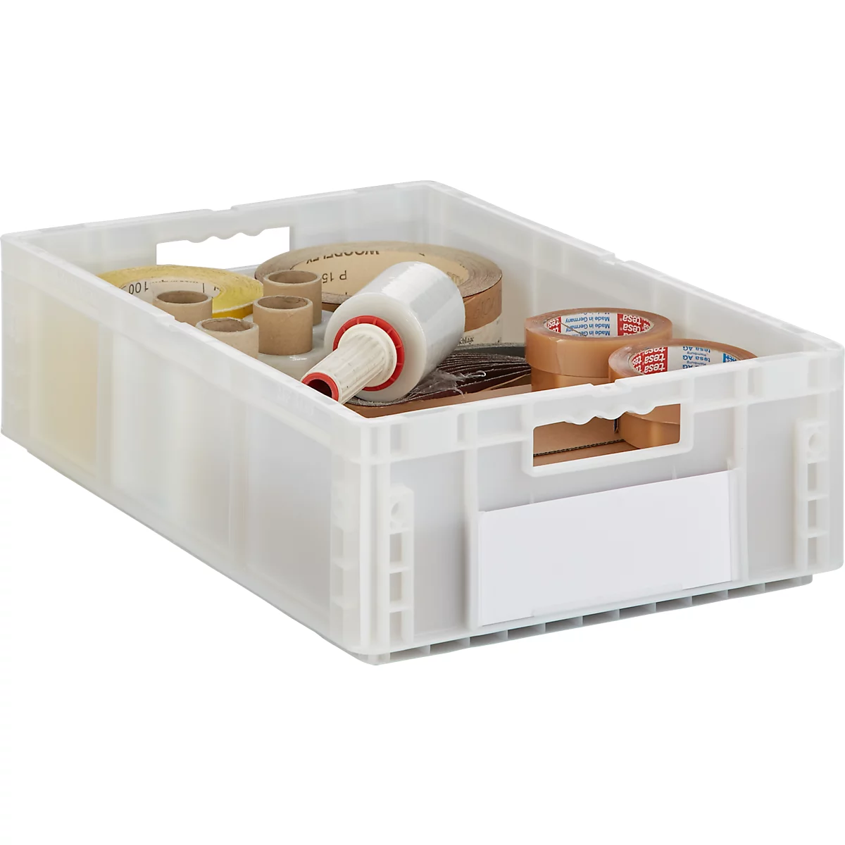 Transparente Kunststoffbox mit Klebebändern, Folienrolle und Papierrollen. Auf der Box befindet sich ein weisses Etikett.