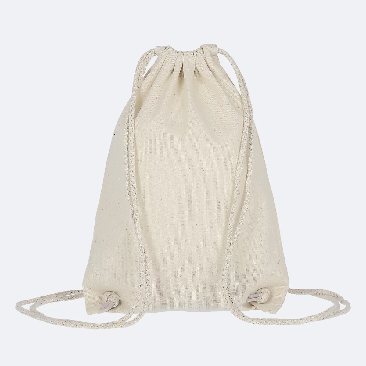Beige stoffen tas met trekkoord.