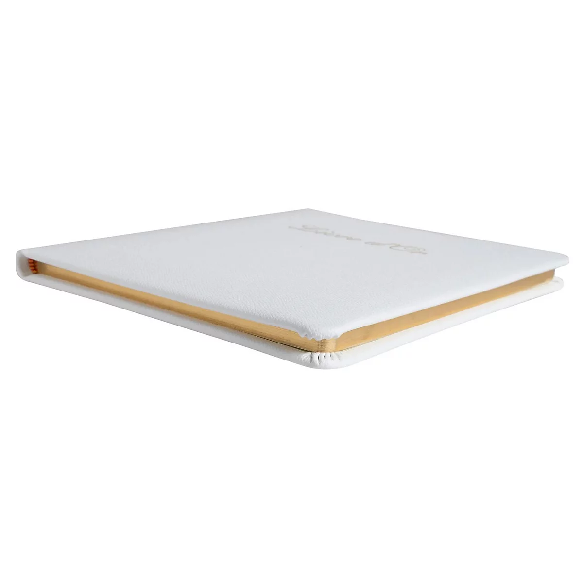 Livre blanc avec des bords dorés. Inscription sur la couverture.