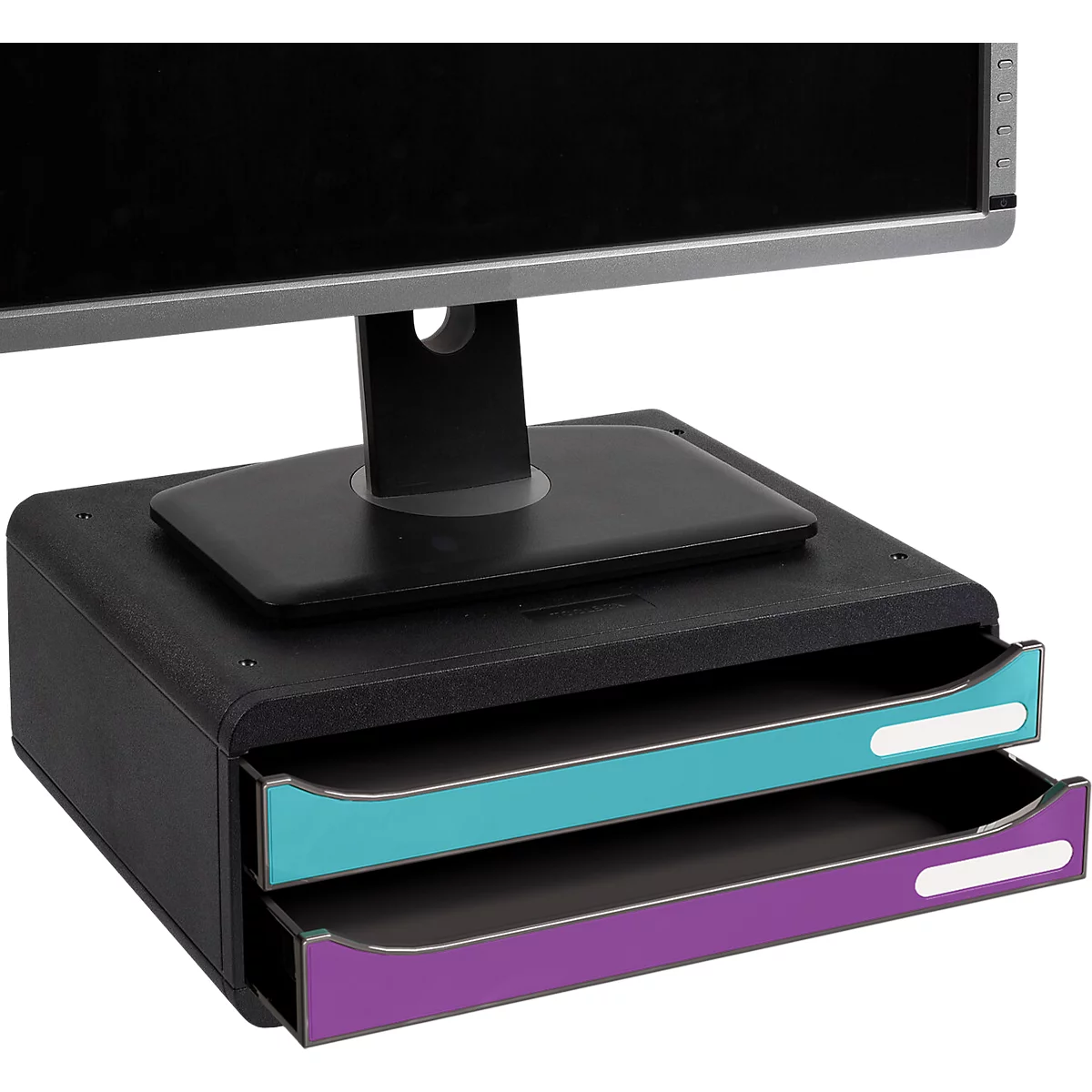 Zwarte monitorstandaard met twee gekleurde lades in turquoise en paars op een bureau.