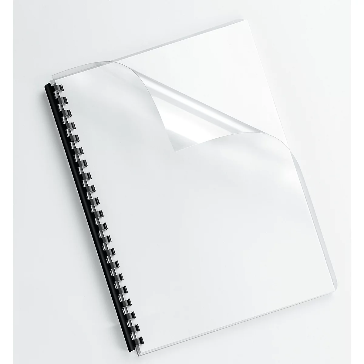 A white notebook with a black spiral binding and a transparent protective film, which is slightly lifted.