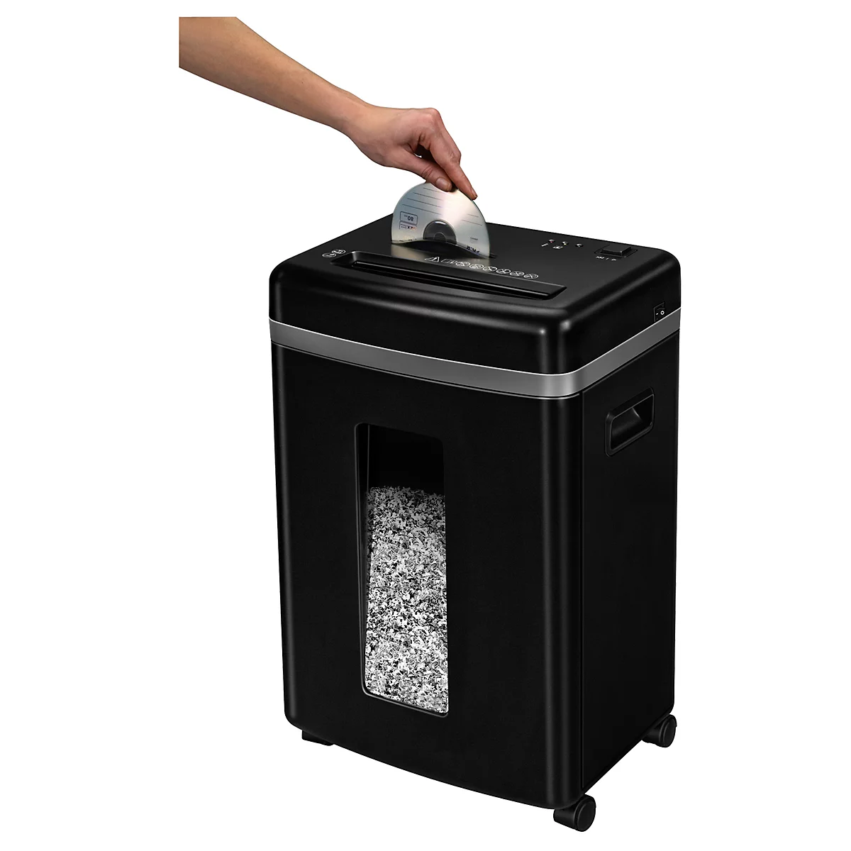 A hand places a CD into a black shredder. Shredded paper is visible in the window.