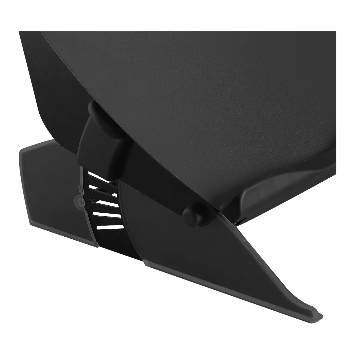 Close-up of a black component with openings and rounded corners.