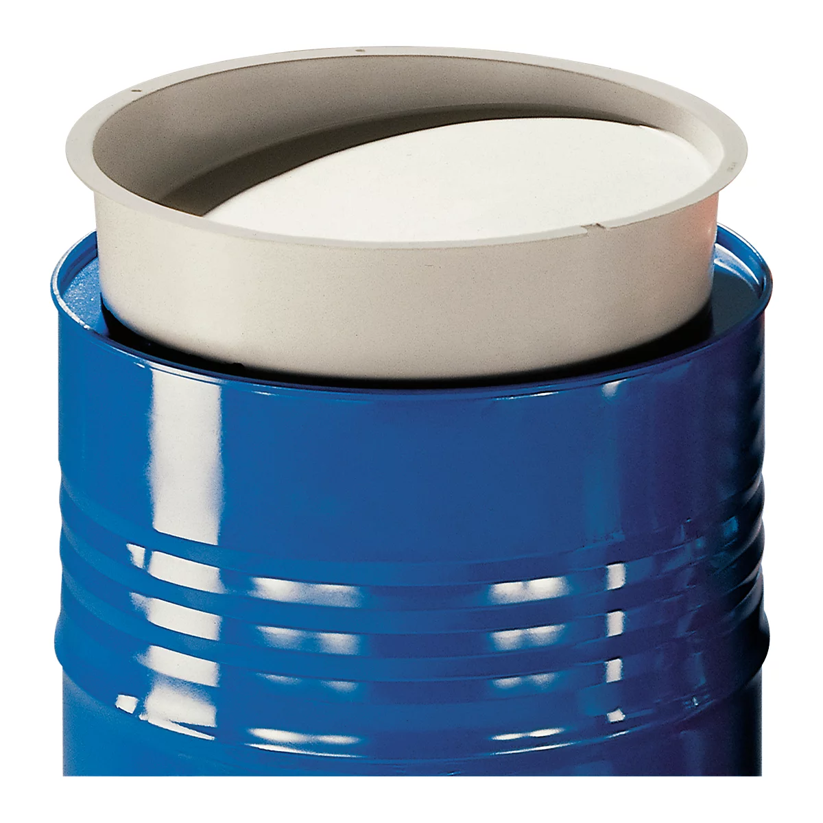 Blue barrel with gray insert and white material inside. The insert sits on the barrel.