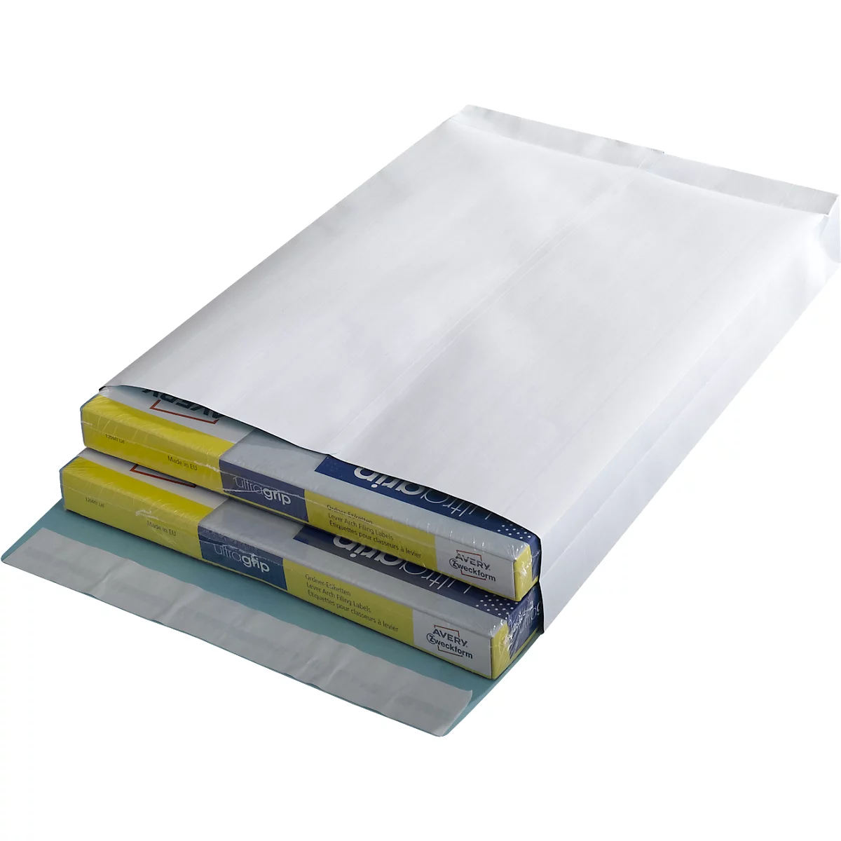 White padded envelope containing two flat boxes. The boxes are partially visible, with yellow and blue accents and writing.
