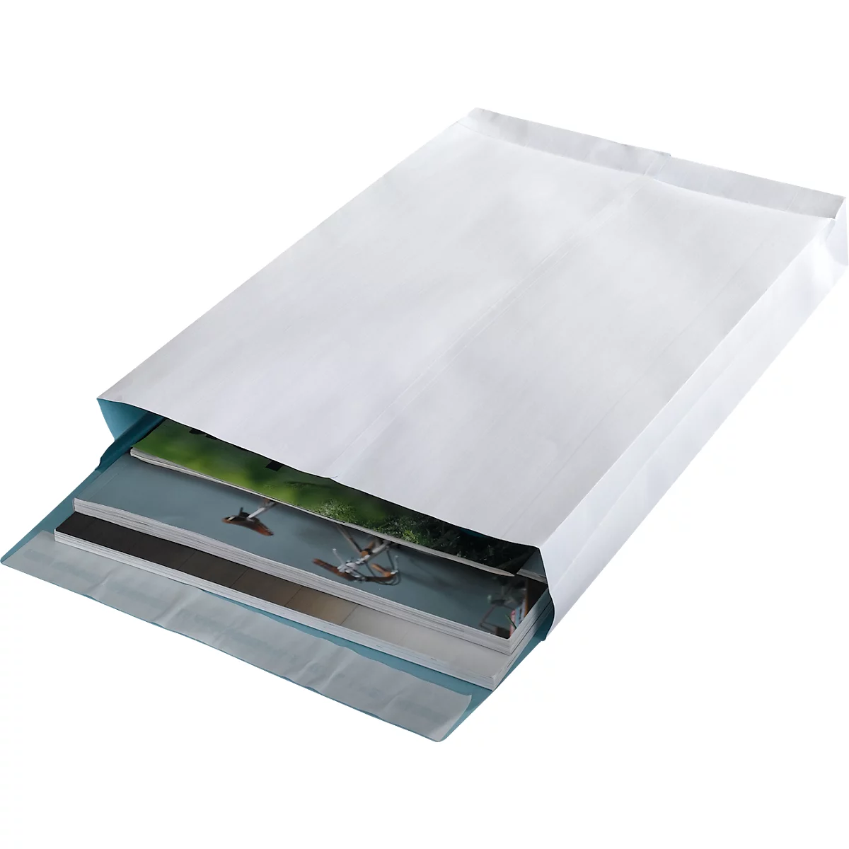 A white envelope filled with brochures rests on a light surface.
