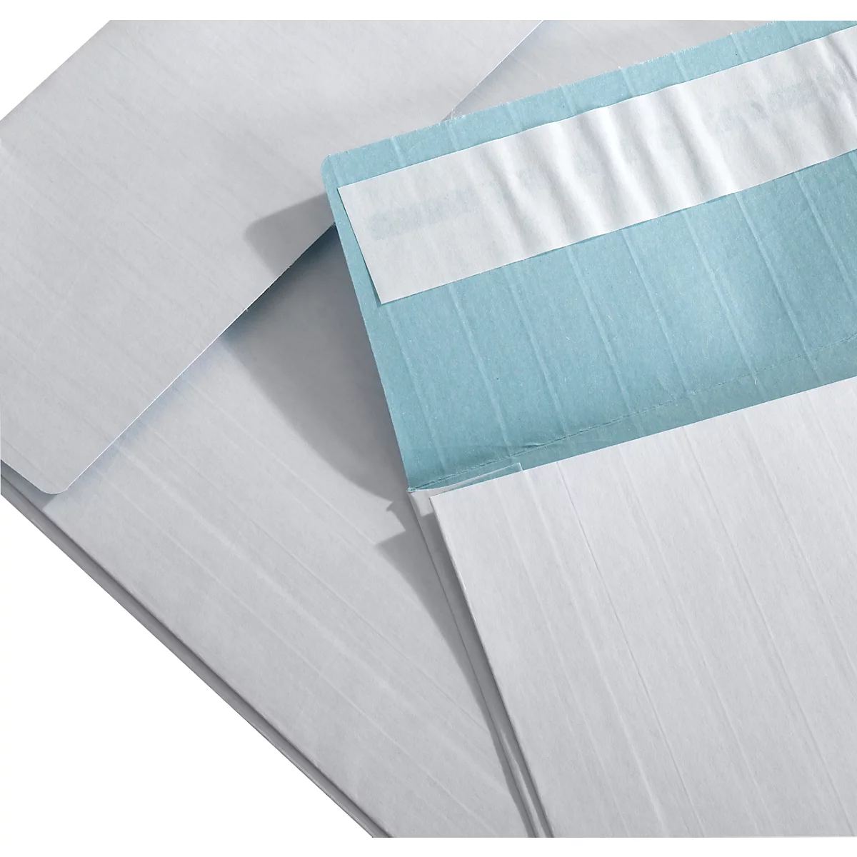 Close-up of several white envelopes, partially open. A blue envelope is sealed with a white adhesive strip.